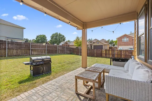 a view of swimming pool with outdoor seating