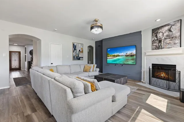 a living room with furniture and a flat screen tv