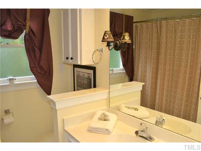 901 Streamer Court Raleigh, NC 27614 - Photo 11 of 21 Full hall bathroom with tile floor and tub/shower with tile surround