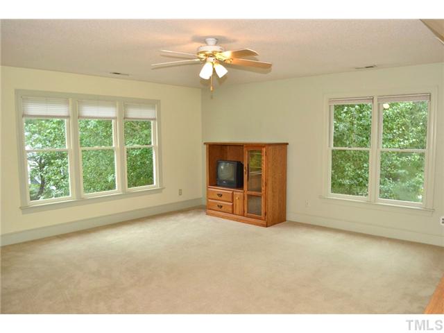 901 Streamer Court Raleigh, NC 27614 - Photo 13 of 21 Large second floor bonus room with large windows, ceiling fan, and closet with shelves