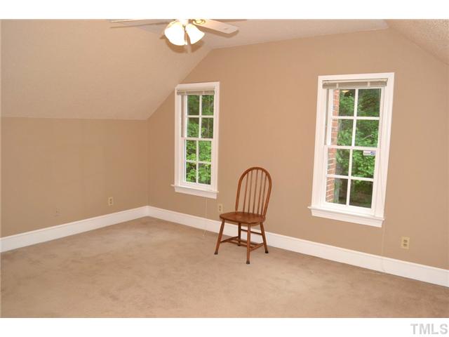 901 Streamer Court Raleigh, NC 27614 - Photo 14 of 21 Third floor bedroom with ceiling fan and large double door closet