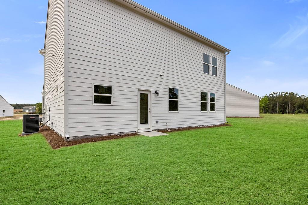 172 Sweet Water Lane Southeast Rome, GA 30161 - Photo 28 of 29 a view of a backyard with a garden