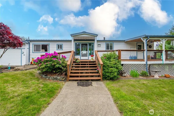 a front view of a house with garden