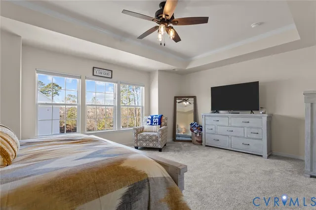 a bedroom with furniture and flat screen tv