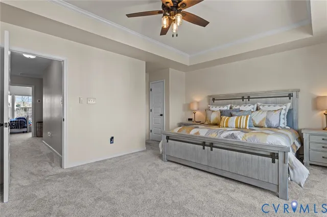 a bedroom with a bed and ceiling fan