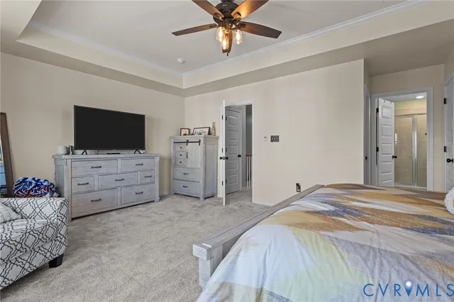 a bed room with furniture and a flat screen tv