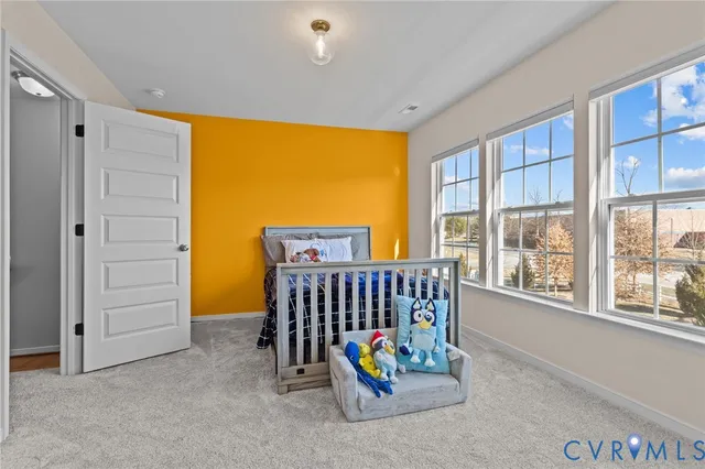 a bathroom with a sink a toilet and shower curtain