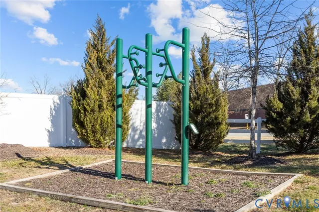 a front view of a building with a garden