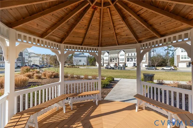 a front view of a building with a garden