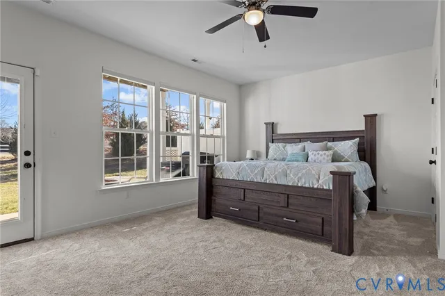 a bed room with a bed and a window