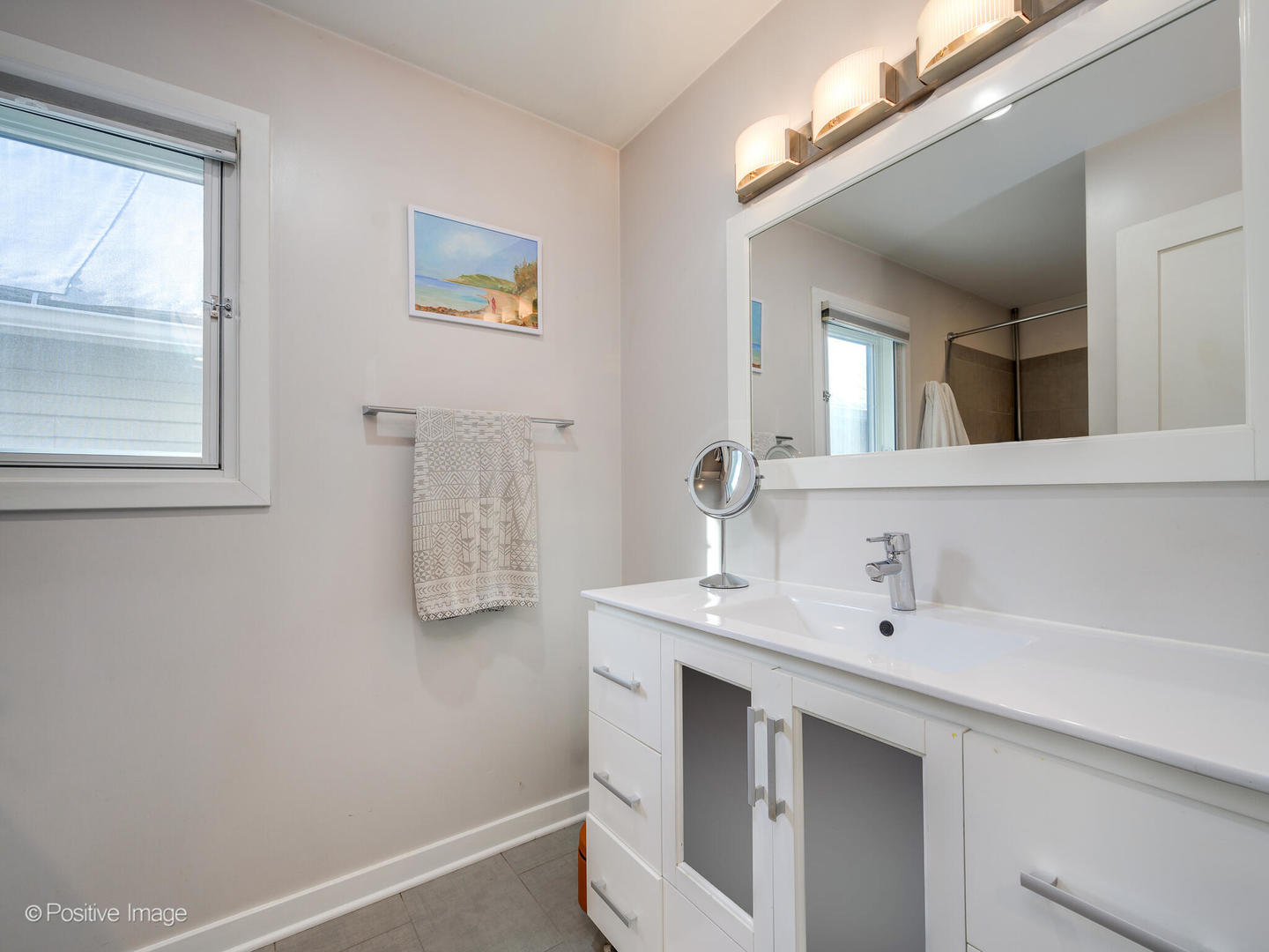 2139 North Bingham Street Chicago, IL 60647 - Photo 12 of 24 a bathroom with a sink and a mirror