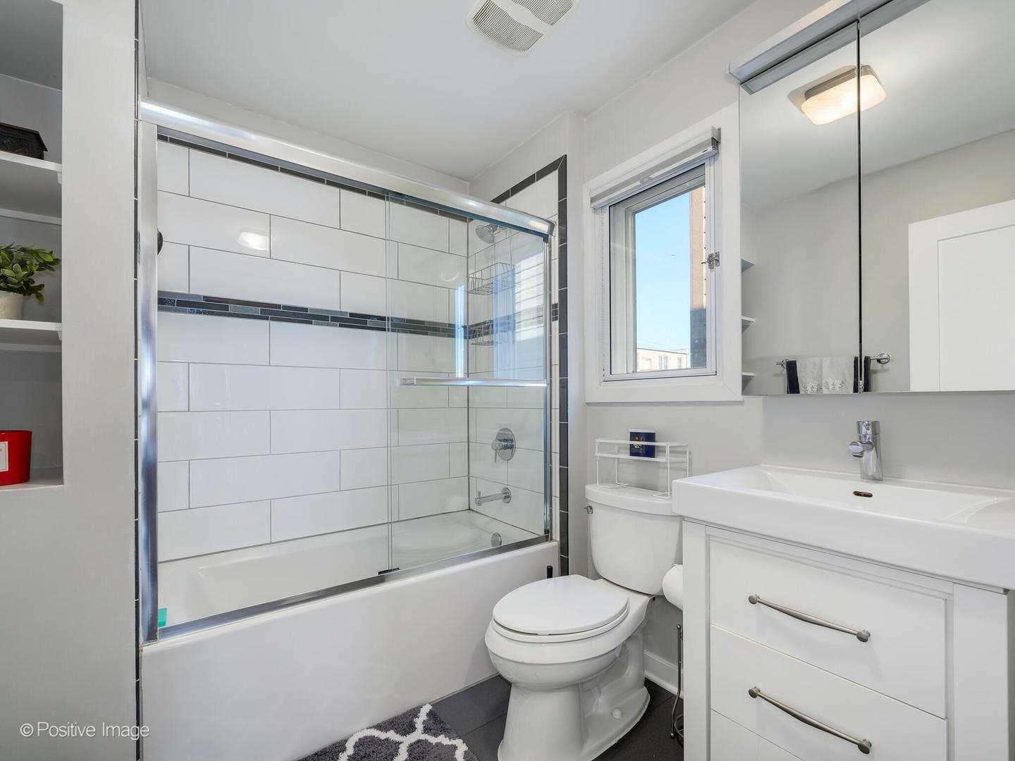 2139 North Bingham Street Chicago, IL 60647 - Photo 13 of 24 a bathroom with a sink toilet and shower