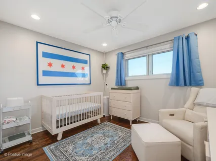 a bedroom with furniture and a rug