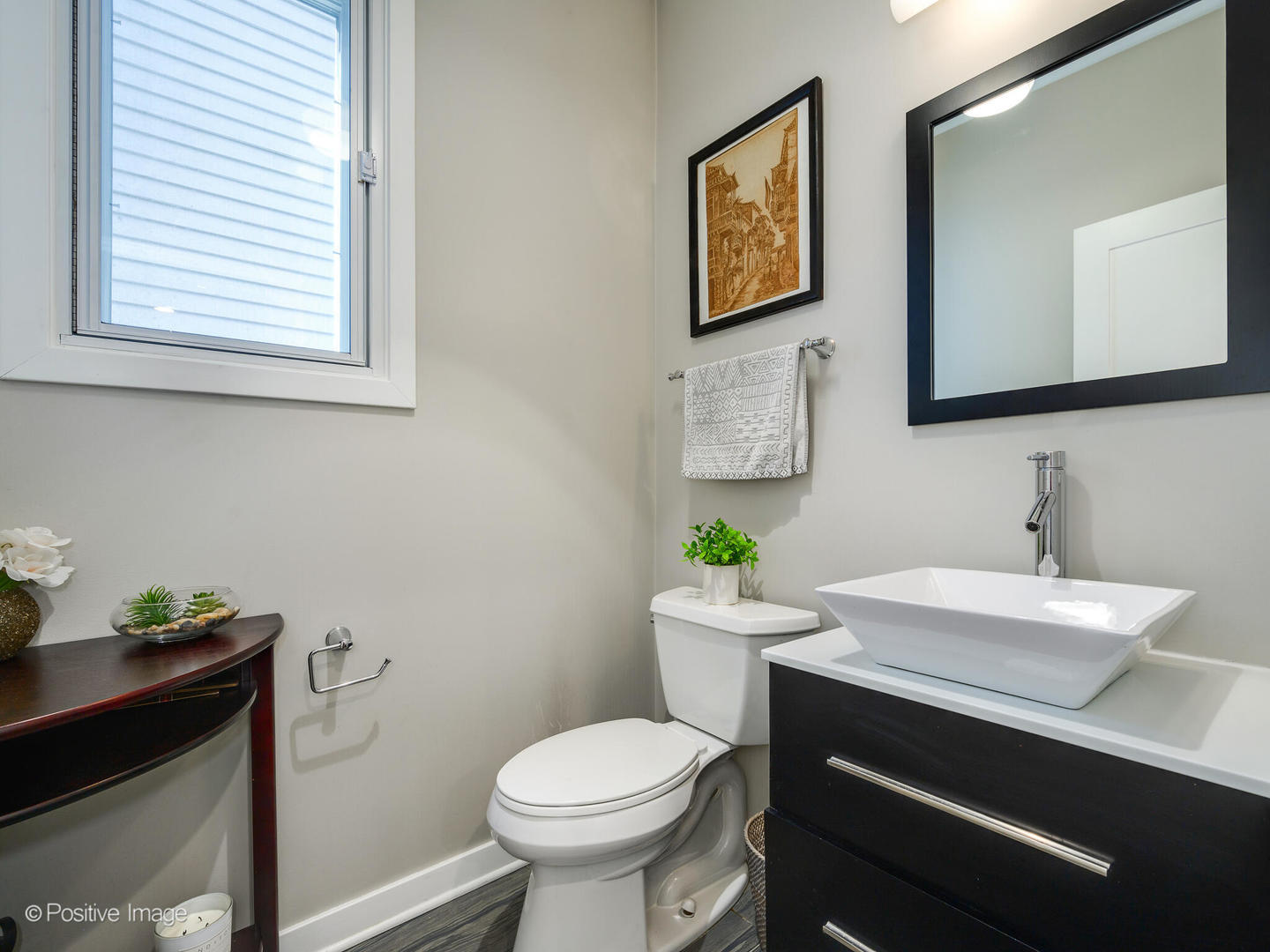 2139 North Bingham Street Chicago, IL 60647 - Photo 17 of 24 a bathroom with a toilet sink and mirror