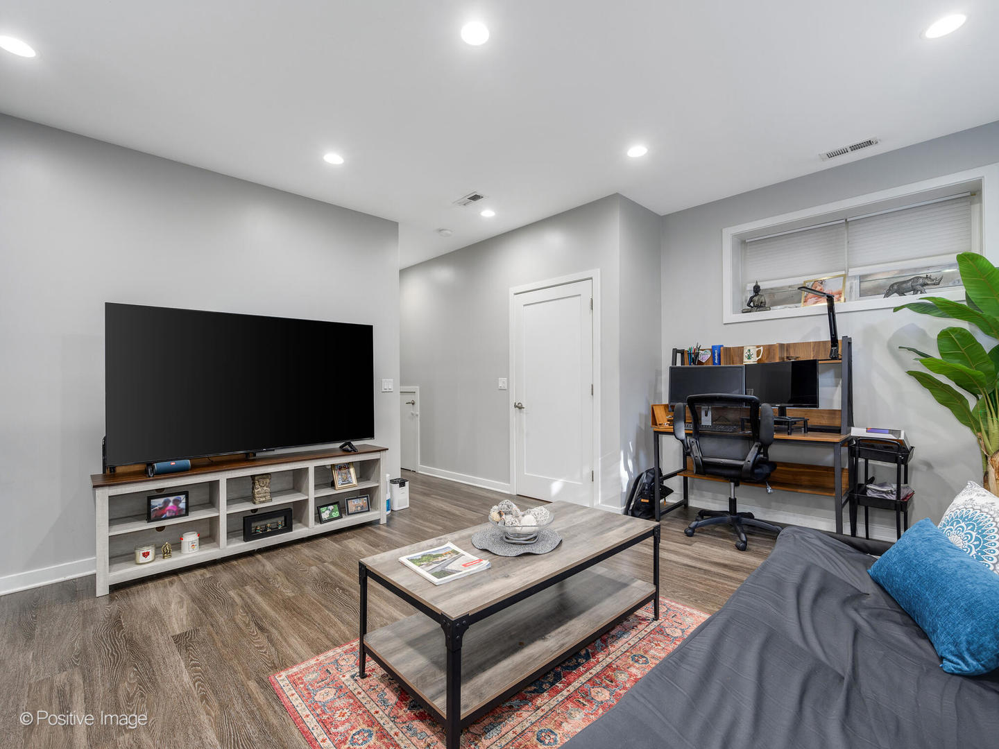 2139 North Bingham Street Chicago, IL 60647 - Photo 18 of 24 a living room with furniture and a flat screen tv