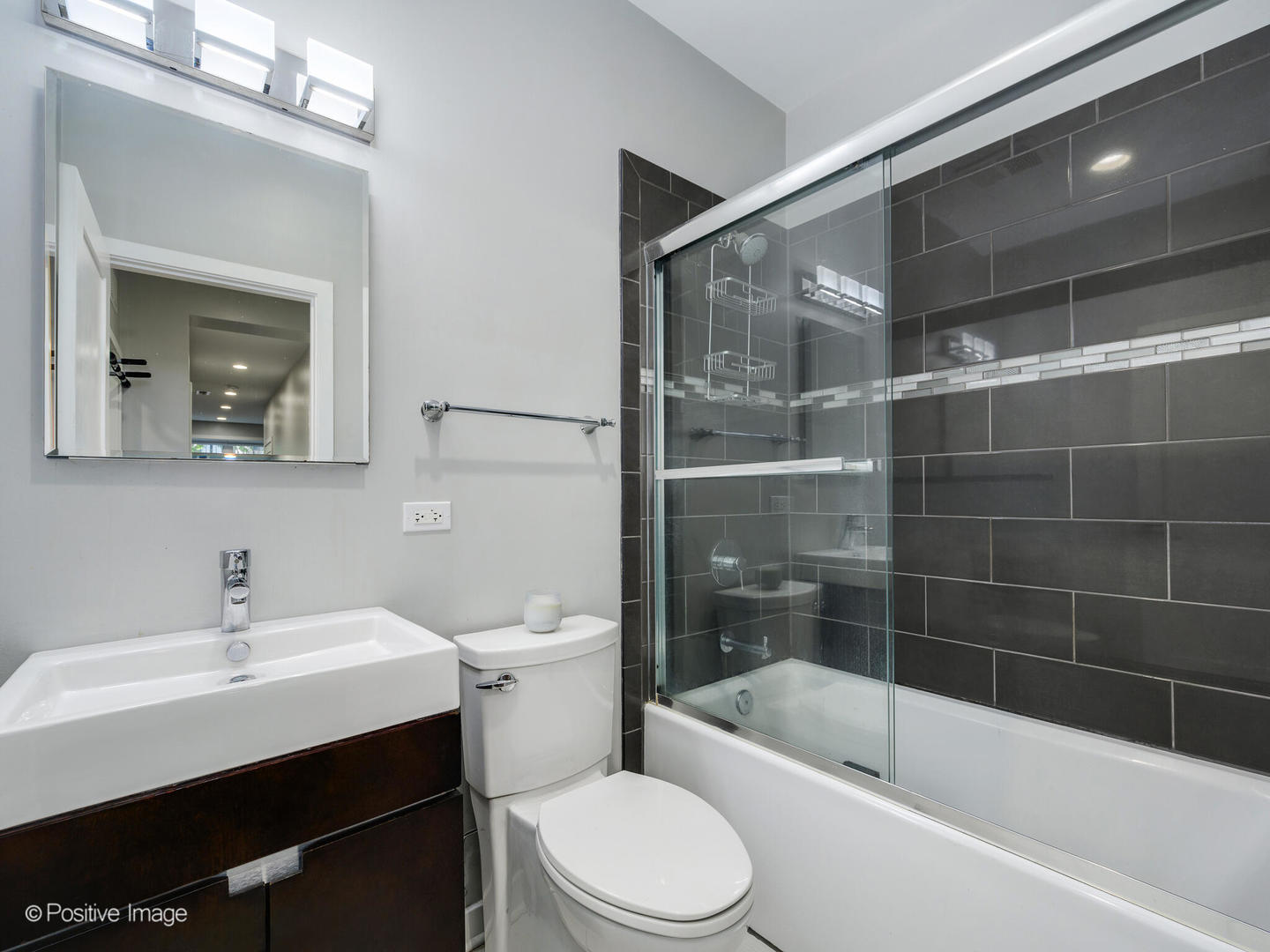 2139 North Bingham Street Chicago, IL 60647 - Photo 23 of 24 a bathroom with a sink mirror toilet and bathtub