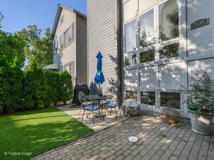 a view of backyard with patio
