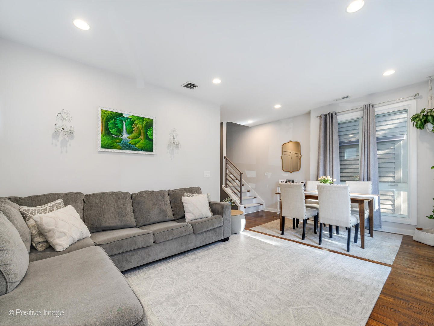 2139 North Bingham Street Chicago, IL 60647 - Photo 4 of 24 a living room with furniture a rug and a flat screen tv