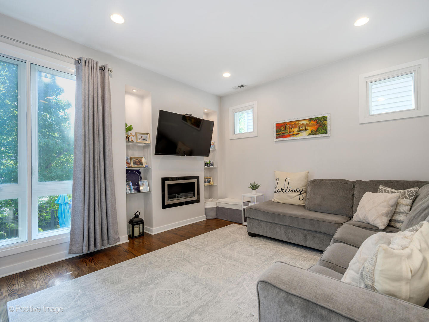 2139 North Bingham Street Chicago, IL 60647 - Photo 5 of 24 a living room with furniture a fireplace and a flat screen tv