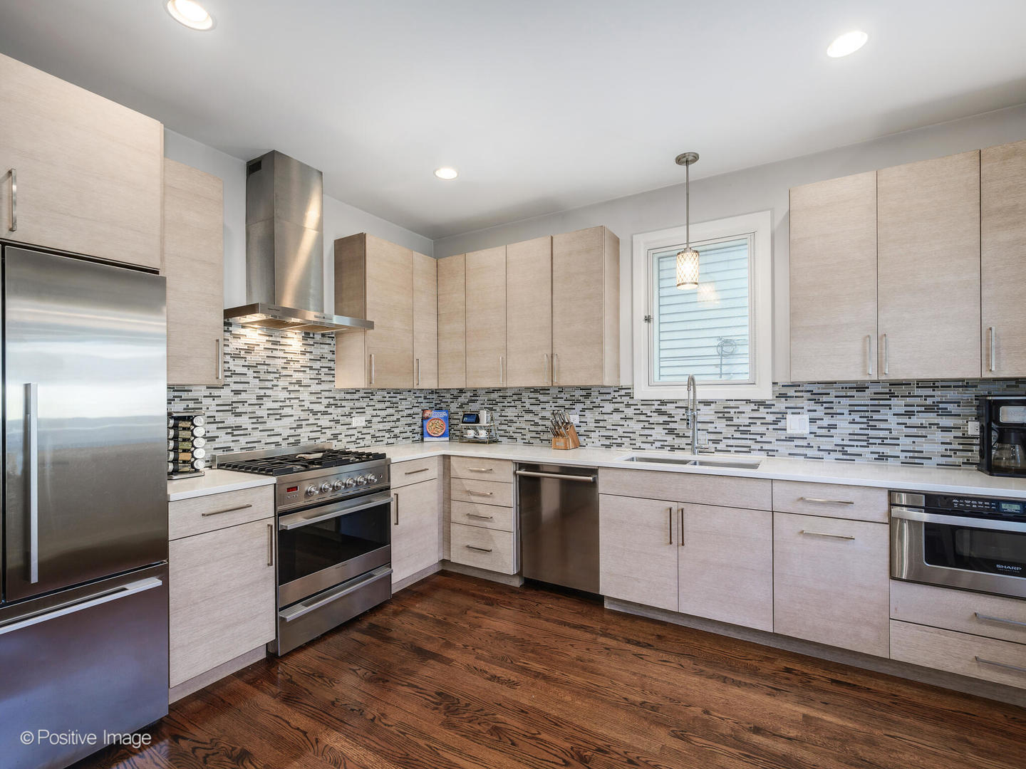 2139 North Bingham Street Chicago, IL 60647 - Photo 8 of 24 a kitchen with stainless steel appliances granite countertop a stove and a sink