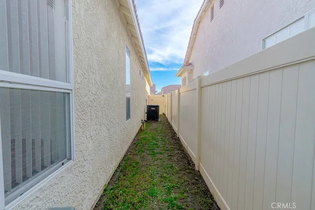 a view of a pathway of a house with wooden floor