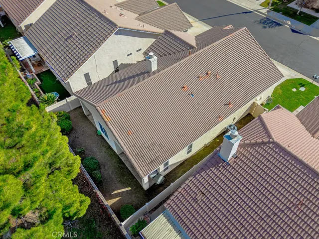 an aerial view of residential houses with outdoor space and river