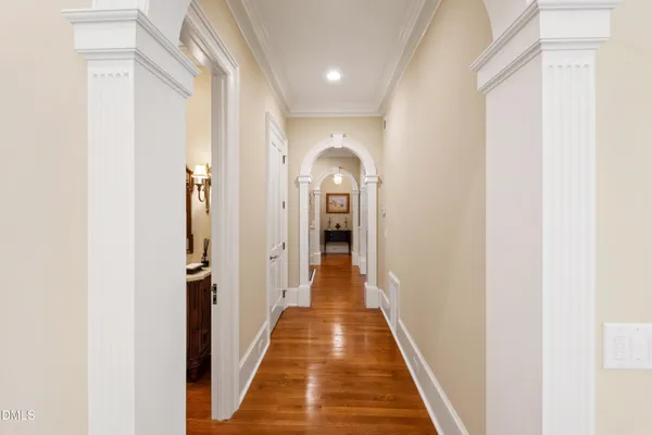 a view of a dining room with furniture wooden floor and chandelier