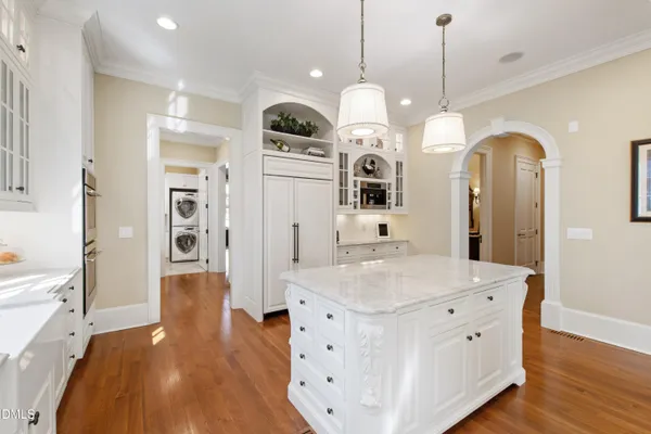 a living room with furniture a fireplace and a large window