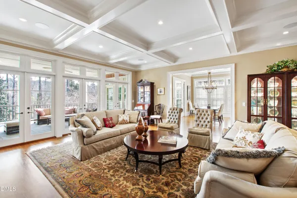 a view of a livingroom with furniture and hardwood floor