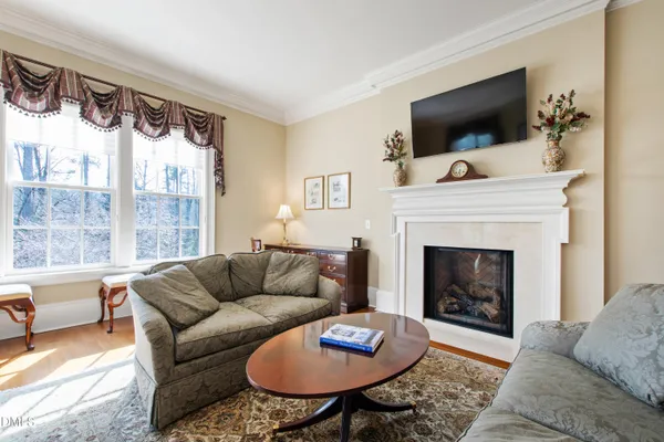 a living room with pool table and a large window