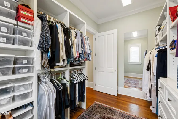 a view of backyard with swimming pool and sitting area