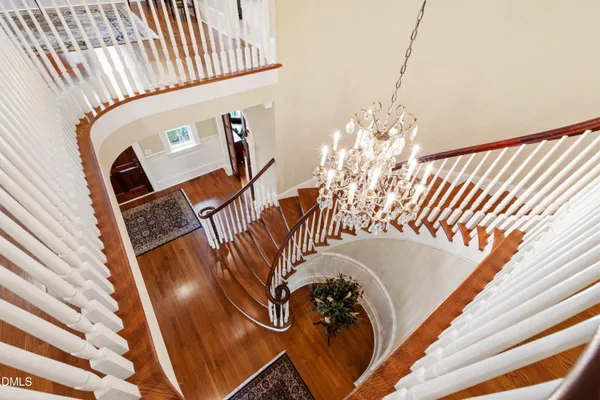 a view of a chair and table in the garden