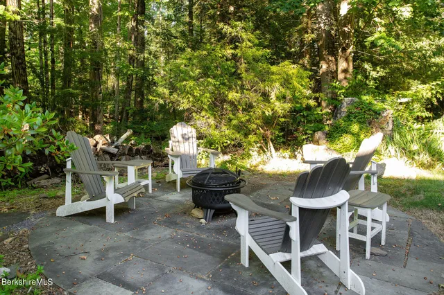 a view of living room with furniture and wooden floor