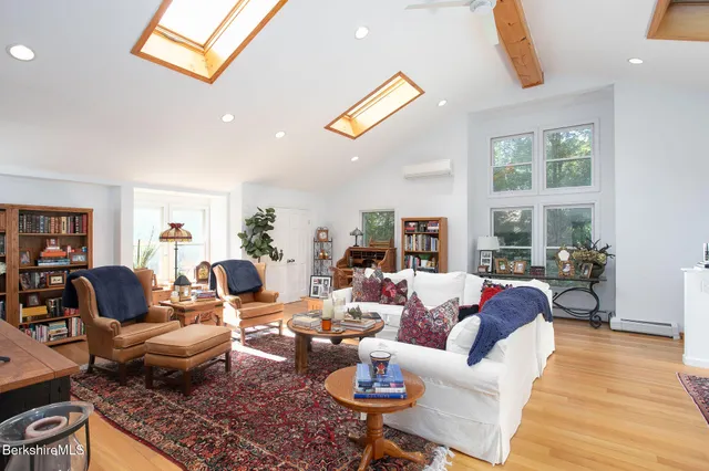 a kitchen with stainless steel appliances kitchen island granite countertop a refrigerator stove and microwave