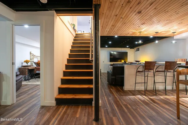 a bathroom with a toilet and a mirror
