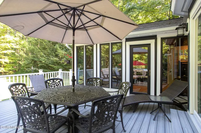 a view of a house with a porch and furniture