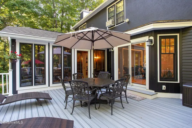 an outdoor space with furniture and umbrella