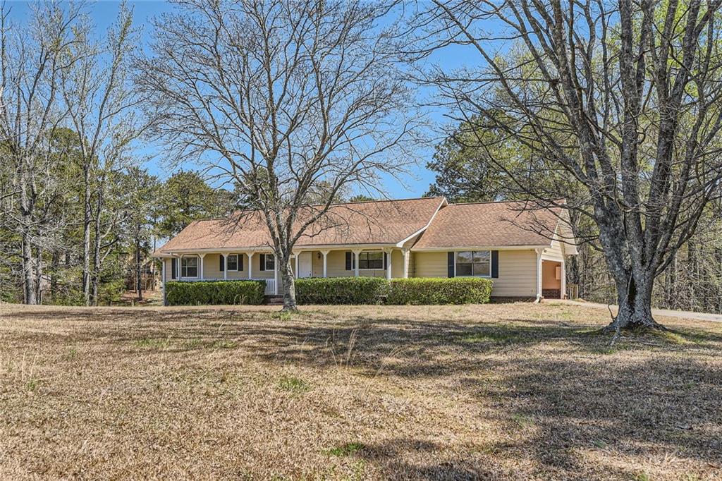 12142 Panhandle Road Hampton, GA 30228 - Photo 1 of 1 a front view of a house with a yard