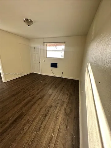 a view of an empty room and window