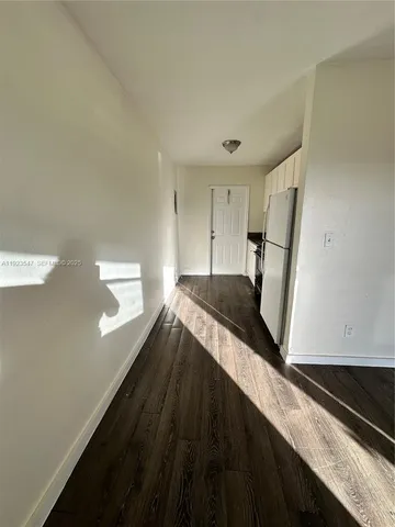 a view of a hallway with staircase