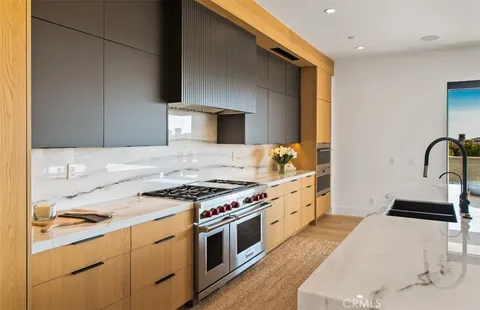 a kitchen with a stove and a sink