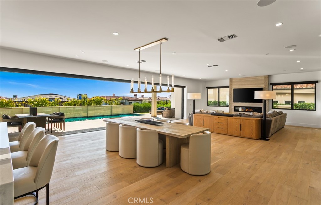 75 Ritz Cove Drive Dana Point, CA 92629 - Photo 15 of 49 a kitchen with stainless steel appliances kitchen island granite countertop a stove and a living room