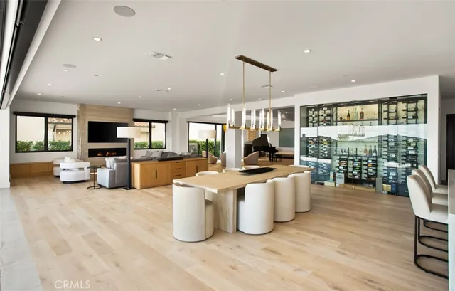 a living room with furniture a flat screen tv and a large window