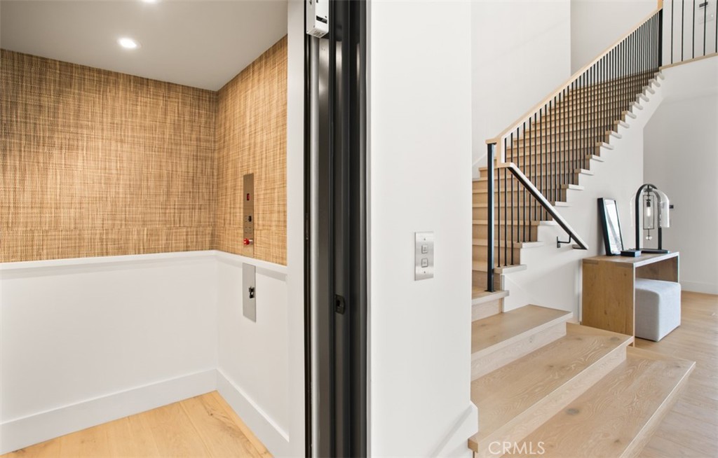 75 Ritz Cove Drive Dana Point, CA 92629 - Photo 24 of 49 a view of entryway with stairs and wooden floor