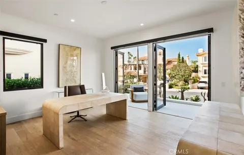 a room with a bed and a large window