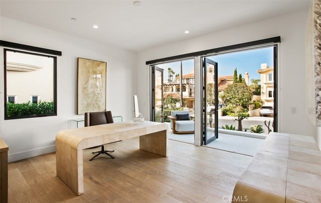 a room with a bed and a large window