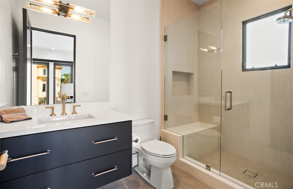 75 Ritz Cove Drive Dana Point, CA 92629 - Photo 26 of 49 a bathroom with a sink a toilet and shower