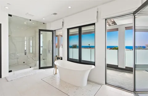 a bathroom with a bathtub and a shower