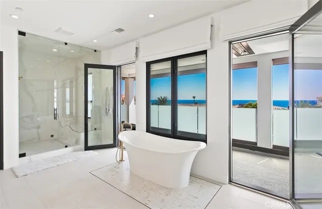 a bathroom with a bathtub and a shower
