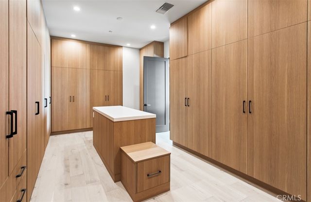 a bathroom with a sink a mirror and a shower